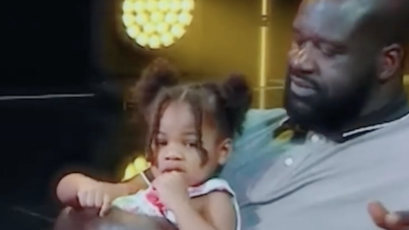 Shaquille O'Neal with a little girl