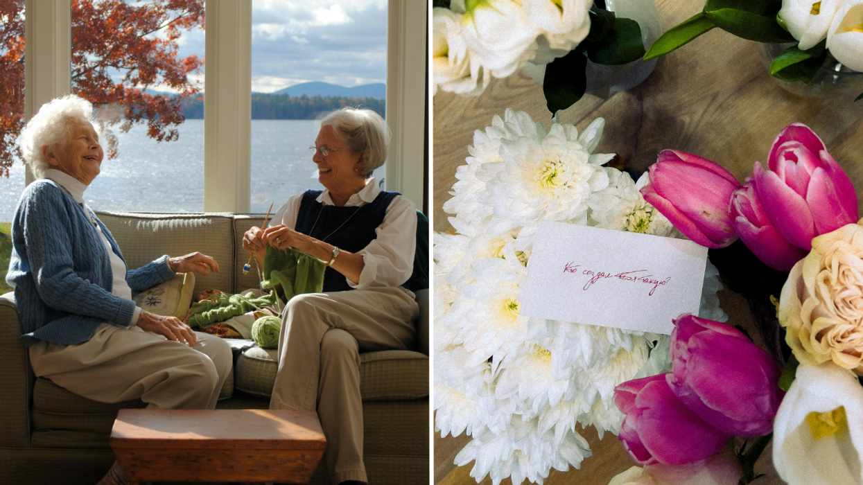 Two elderly women laughing and chatting near a window and bouquet of flowers with a note.