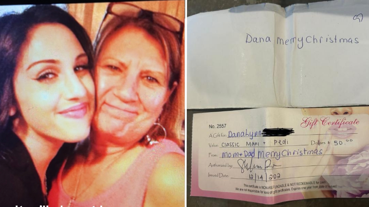 Young woman hugging her mother and a gift certificate and envelope.